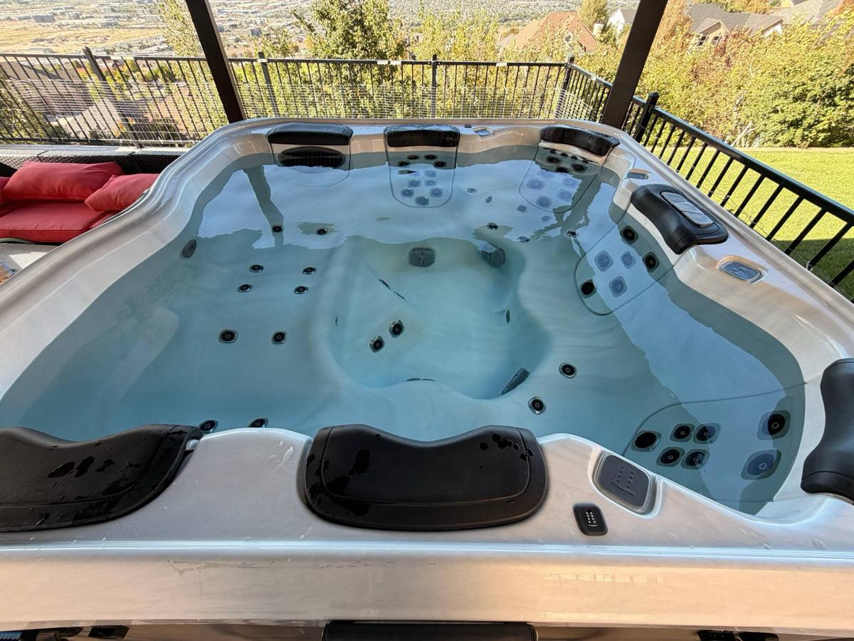 The same hot tub with clear blue water after a deep clean